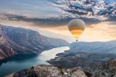 Hot air balloons flying over the Botan Canyon in TURKEY